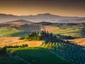 Scenic Tuscany landscape with rolling hills and valleys at sunset