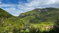 Scenic valley of river Kolpa encircled with green vegetation and mountains in Solveina