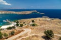 Scenic view from the acropolis on a bay with blue and turquoise water in Lindos on Rhodes island, Greece Royalty Free Stock Photo