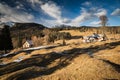 Scenic view in alpine forest mountains with isolated wooden chalet house in idyllic sunny winter environment, pokljuka, slovenia Royalty Free Stock Photo