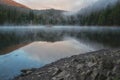 Scenic view of alpine lake Synevyr, Carpathian mountains, amazing nature landscape with morning mist Royalty Free Stock Photo