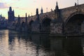 Scenic view of ancient Charles Bridge over Vltava River during summer sunrise. Close-up photo Royalty Free Stock Photo