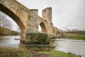 Scenic view of an ancient stone medieval bridge on a cloudy day in Frias, Castilla y Leon, Spain. Royalty Free Stock Photo