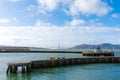 Scenic view of Aquatic Park and Municipal Pier in San Francisco Bay. Golden Gate Bridge and seascape background on horizon