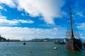 Scenic view of Aquatic Park under blue and cloudy sky. Moored historic ships preserved by Maritime National Historical Park