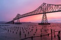 Scenic view of Astoria-Megler Bridge silhouetted against a colorful sunset sky Royalty Free Stock Photo