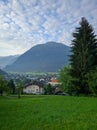 Scenic view of the Austrian village of Wolfurt against the backdrop of the Alps and green meadows. Vertical. Wolfurt, Austria Royalty Free Stock Photo