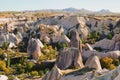 Scenic view of autumn nature landscape of Cappadocia. Amazing shaped sandstone rocks with autumn colored leaves on the trees. Royalty Free Stock Photo