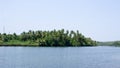 Scenic view of backwaters of Kerala with coconut trees on it's banks Royalty Free Stock Photo