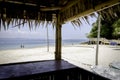 Scenic view from bamboo hut,beautiful tropical white sandy beach at sunny day. Royalty Free Stock Photo