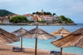 Scenic view of the beach and old town of Primosten with medieval architecture, tourist sea resort on Adriatic seacoast, Croatia