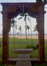 Scenic view of the beach through the swing gate