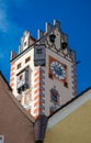 Scenic view of beautiful clock tower of church in Fussen old town city center, Bavaria, Germany