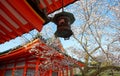 Scenic view of a beautiful corner in Heian Jingu Shrine in Kyoto Japan, with a traditional Japanese lantern hanging under wooden Royalty Free Stock Photo