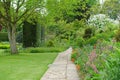 Garden Path with a Lawn and Flower Bed Royalty Free Stock Photo