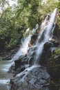 scenic view of beautiful Kanto Lampo Waterfall, green plants and rocks, Royalty Free Stock Photo