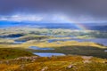 Scenic view of beautiful lakes, clouds and rainbow in Inverpolly area, Scotland