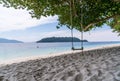Scenic view of beautiful Sai Khao white sand Beach with swing in Ra Wi Island, Southern of Thailand