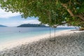 Scenic view of beautiful Sai Khao white sand Beach with swing in Ra Wi Island, Southern of Thailand