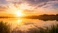 Scenic view of beautiful sunset or sunrise above the pond or lake at spring or early summer evening. Royalty Free Stock Photo