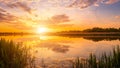 Scenic view of beautiful sunset or sunrise above the pond or lake at spring or early summer evening. Royalty Free Stock Photo