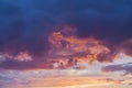 Scenic view of beautiful sunset, vibrant golden and purple clouds, evening sky. Natural background, art shades Royalty Free Stock Photo