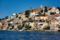 Scenic view of the beautiful Symi Island with traditional buildings in the coastline in Greece