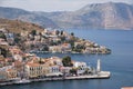 Scenic view of the beautiful Symi Island with traditional buildings in the coastline in Greece