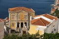 Scenic view of the beautiful Symi Island with traditional buildings in the coastline in Greece