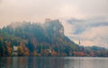 Scenic view of Bled lake at foggy autumn morning Royalty Free Stock Photo