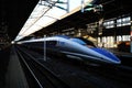 Scenic view of a blue Japanese high-speed train, the Shinkansen railway