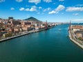 Scenic view of a blue river flowing through the vibrant cityscape of Bilbao, Spain Royalty Free Stock Photo