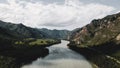 Scenic view of blue water river and forceful mountains. Drone footage Royalty Free Stock Photo