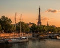 Scenic view of a boat in the Seine river, with the iconic Eiffel Tower in the background at sunset