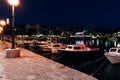 Scenic view of the boats docked at the port of Krk city in Croatia during nighttime