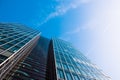 Scenic View from the Bottom of a Beautiful Modern Business Building with Blue Sky Royalty Free Stock Photo