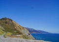 Scenic view of Bridge and Rock Shed at Pitkins Curve and Rain Rocks along rugged coastline of Big Sur with Santa Lucia Mountains