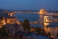 Scenic view of Budapest city at blue hour with illuminated Chain Bridge, Hungarian Parliament and Danube embankment Royalty Free Stock Photo