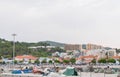 Scenic view of buildings in the fishing port in Setubal, Portugal on a cloudy day