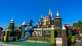 Scenic view of a cartoon castle in a green vibrant park on a sunny day