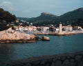 Scenic view of Cassis Lighthouse with the cityscape and mountains in the background. France Royalty Free Stock Photo