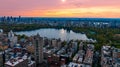 Scenic view of Central Park in the cityscape of New York, the USA. Aerial perspective. Enormous city panorama at sunset. Royalty Free Stock Photo