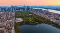 Scenic view of Central Park in the cityscape of New York, the USA. Aerial perspective. Enormous city panorama at sunset. Royalty Free Stock Photo
