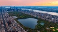 Scenic view of Central Park in the cityscape of New York, the USA. Aerial perspective. Enormous city panorama at sunset. Royalty Free Stock Photo