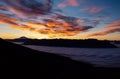 Scenic view of Cerro Tronador peak above clouds at sunrise