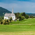 Scenic view of a chapel and green hills over the German countryside in the village Kappel