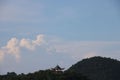 Scenic view of a Chinese Pavilion on a mountain range covered with green plants Royalty Free Stock Photo