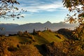 Scenic view of The Church of St. Primoz and Felicijan on an evergreen hill in Jamnik, Slovenia Royalty Free Stock Photo