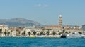 Split, Croatia - 07 22 2015 - Scenic view of the city with bell tower from the water, beautiful cityscape with mountain background