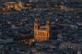 Scenic view of the city skyline at night with the Notre Dame illuminated in Paris, France Royalty Free Stock Photo